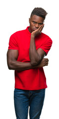 Young african american man over isolated background thinking looking tired and bored with depression problems with crossed arms.