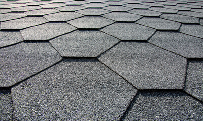 Hexagonal gray shingle roof tile closeup