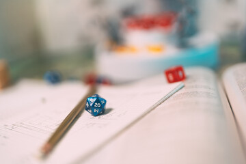 Blue dice D12 place for role playing tabletop game and board game