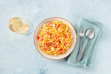 Carbonara pasta dish, traditional Italian spaghetti with pancetta and cheese, overhead flat lay...