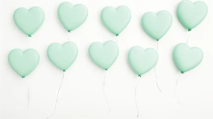  Mint green heart-shaped balloons on a clean white background © artem