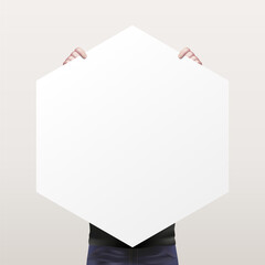 The man holding a white empty sheet of paper