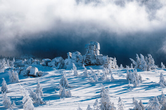 Cloudy morning in the Giant Mountains with snow covering rocks and trees