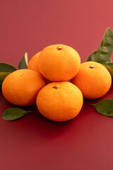 Chinese lunar new year background with fresh tangerine and red envelope.