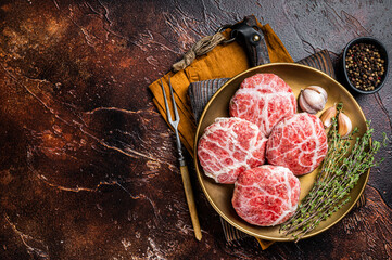 Raw french meatballs cutlet with spices and herbs. Dark background. Top view. Copy space - obrazy, fototapety, plakaty