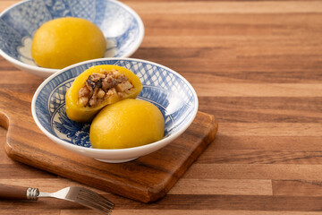 Sweet potato yam bun with ground pork meat, mushroom and chopped bamboo shoot fillings inside.