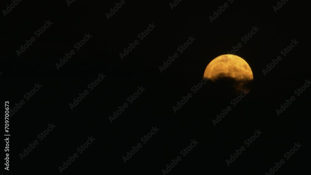 Wall mural clouds movement in front of moon
