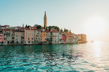 Fototapeta premium Scenic view of the colorful houses on the coastline in Rovinj, Croatia at golden sunset