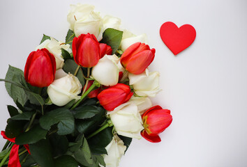 Happy Valentine's Day card. bouquet of tulips and red valentines heart