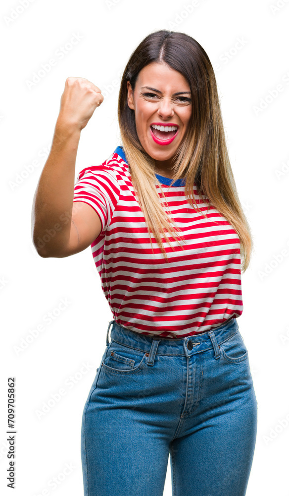 Canvas Prints Young beautiful woman casual look over isolated background angry and mad raising fist frustrated and furious while shouting with anger. Rage and aggressive concept.