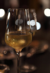 Two glasses of the white wine in the night