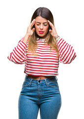 Young beautiful woman casual stripes winter sweater over isolated background with hand on head for pain in head because stress. Suffering migraine.