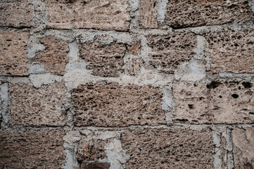 An old brick wall, the facade of the building. Abstract texture background