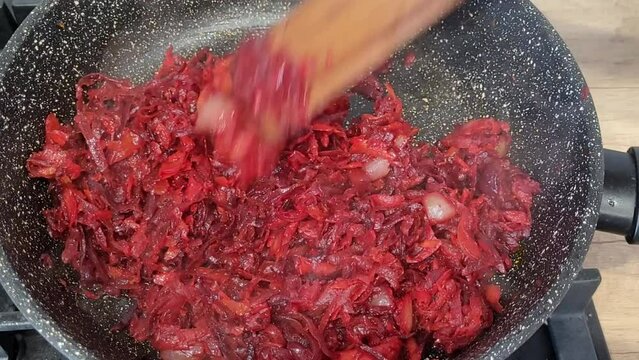 Cooking beets in a pan. Preparing frying for Russian beetroot borscht