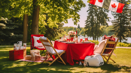 Obraz na płótnie Canvas enjoying a picnic in a Canadian park, surrounded by flags and decorations, capturing the festive spirit of Canada Day 2024