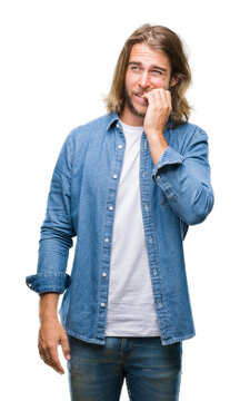Young handsome man with long hair over isolated background looking stressed and nervous with hands on mouth biting nails. Anxiety problem.
