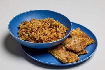 a bowl of mixed rice with vegetables.