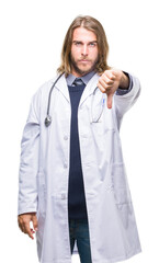 Young handsome doctor man with long hair over isolated background looking unhappy and angry showing rejection and negative with thumbs down gesture. Bad expression.