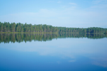 Beautiful forest lake. Panoramic view, landscape. forest reflecting on calm lake.