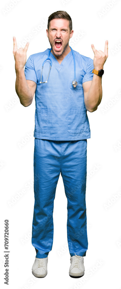 Canvas Prints handsome doctor man wearing medical uniform over isolated background shouting with crazy expression 