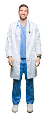 Handsome doctor man wearing medical uniform over isolated background looking away to side with smile on face, natural expression. Laughing confident.
