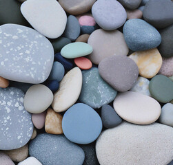 Fototapeta na wymiar Pebbles on the beach. Stone texture with cracks. Close-up. Rough Stone surface. Nature backdrop. Minimalist design 