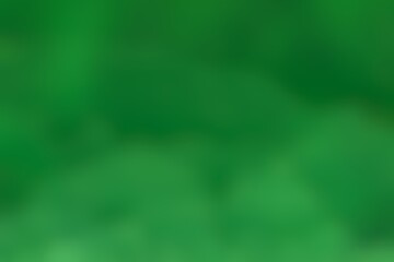 Abstract blurred background image of green colors gradient used as an illustration. Designing posters or advertisements.