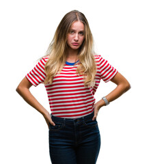 Young beautiful blonde woman over isolated background depressed and worry for distress, crying angry and afraid. Sad expression.