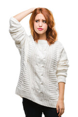 Young beautiful woman over isolated background wearing winter sweater confuse and wonder about...
