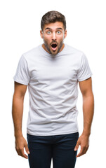 Young handsome man over isolated background afraid and shocked with surprise expression, fear and...