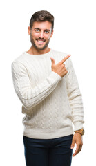 Young handsome man wearing winter sweater over isolated background cheerful with a smile of face...