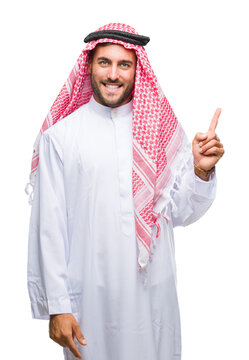 Young handsome man wearing keffiyeh over isolated background with a big smile on face, pointing with hand and finger to the side looking at the camera.