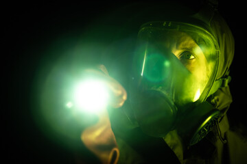 Female Military Scientist With ISO 9000 Gas Mask and Flashing Light in Apocalyptic Darkens Green Light Head Shoot - Concept