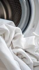 Washing machine with clothes inside, closeup. Laundry concept