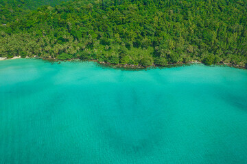Aerial view of beautiful tropical island beach with emerald water at Koh Kood Thailand.