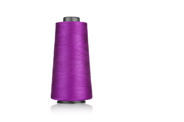 spool of industrial threads pink colors, texture of threads on a white background