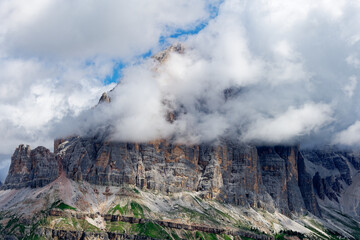 View of Tofane mountain range covered with clouds in the Dolomites, Italy. Amazing destination for trekkers and hikers. Famous mountaineering place.