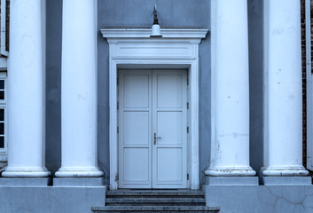 Classical White Double Doors Between Elegant Columns