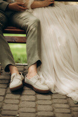 Feet in footwear of the groom and the bride