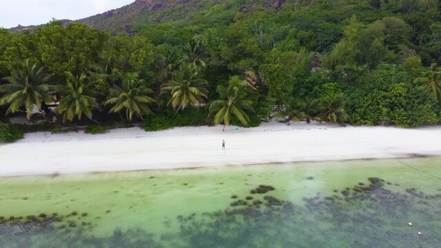 Aerial view of Anse Madge beach from the water. Praslin island, Seychelles
