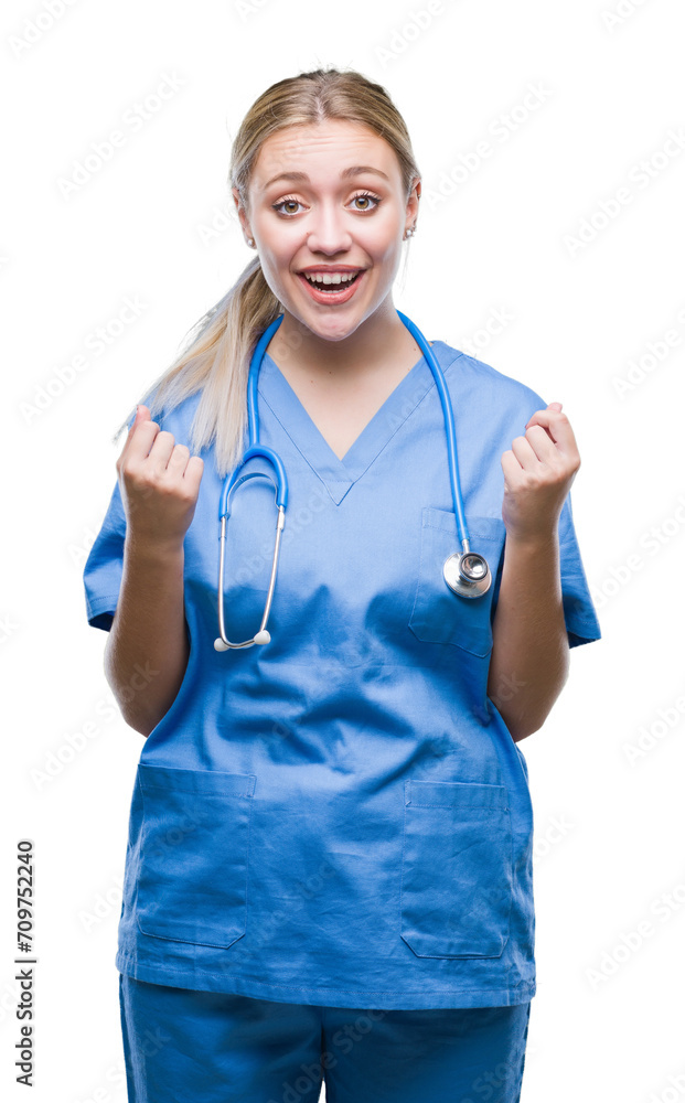 Sticker young blonde surgeon doctor woman over isolated background celebrating surprised and amazed for succ