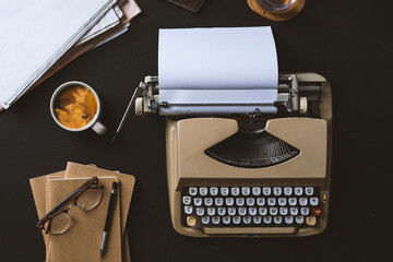 Waiting for an inspiration, Coffee and typewriter on black background