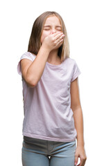 Young beautiful girl over isolated background smelling something stinky and disgusting, intolerable...