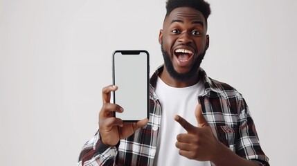 A black man with a big, blank white smartphone is shown in an exciting portrait. - obrazy, fototapety, plakaty