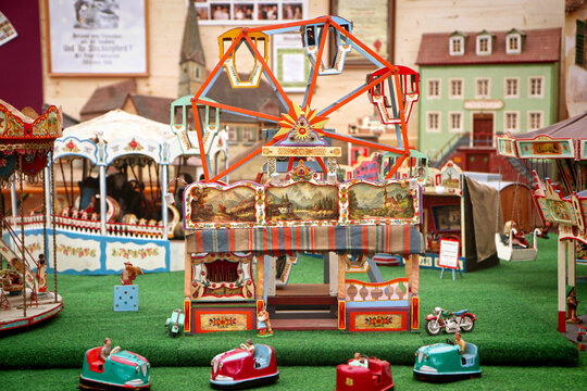 Munich, Germany -  Vintage miniature bumper cars and Oktoberfest carousel models on display in a museum tent at Oide Wiesn historical part of the Oktoberfest in Munich