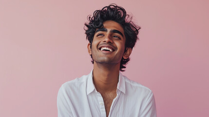 Portrait of a smiling Hindu man pink background