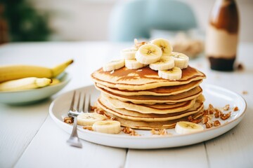 close-up of vegan pancakes with banana slices - obrazy, fototapety, plakaty
