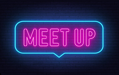 Meet Up neon sign in the speech bubble on brick wall background.