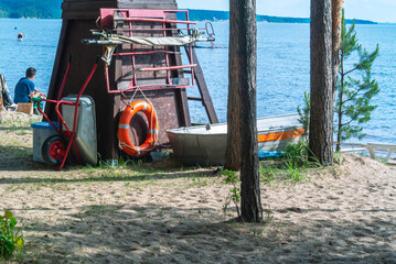 Lifeguard tower on the beach. A tower for organizing a rescue post on the beach. A lifeguard tower on the beach to monitor swimmers in order to prevent drowning. Saving people on the water.
