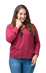 Beautiful plus size young woman over isolated background Pointing to the eye watching you gesture, suspicious expression
